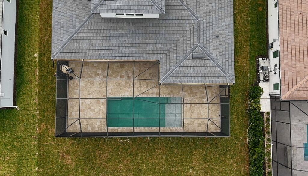 Overhead view of a pool cage enclosure with a 52 foot picture window in Naples Florida