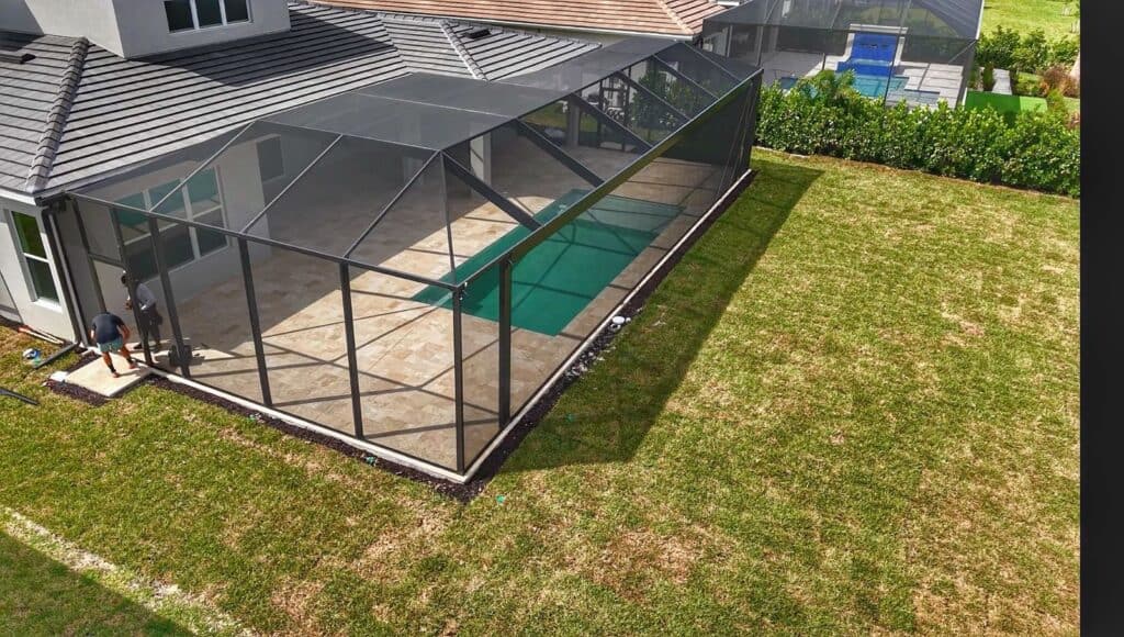 Aerial angle of a 52 foot picture window pool enclosure with uninterrupted clear view