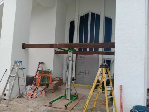 Steel beam installation for custom welded aluminum structure at Heritage Palms in Fort Myers Florida