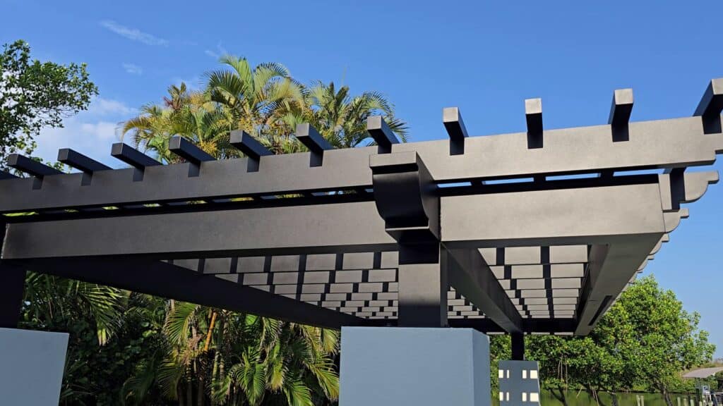 Welded aluminum pergola with integrated rain curtain feature in Fort Myers Florida