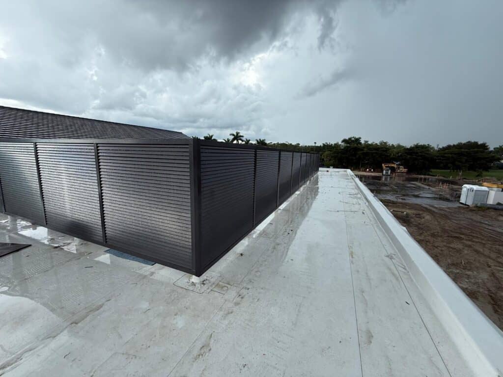 Custom welded aluminum privacy louvers installed on a commercial rooftop for equipment screening and architectural privacy in Florida