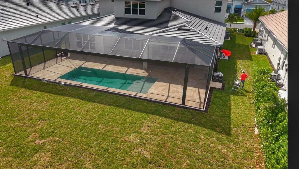 Aerial view of a pool cage with a 52 foot picture window span in Naples Florida