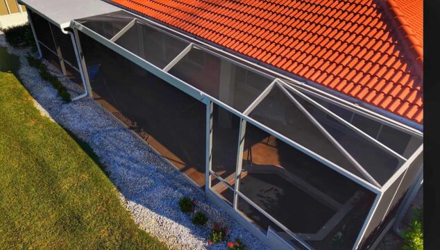 Aerial view of a gable roof pool cage enclosure in Herons Glen North Fort Myers Florida