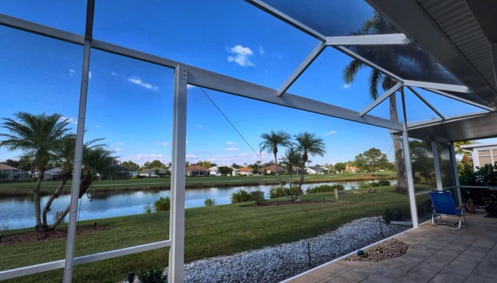 Interior view of picture window pool cage enclosure in Herons Glen North Fort Myers