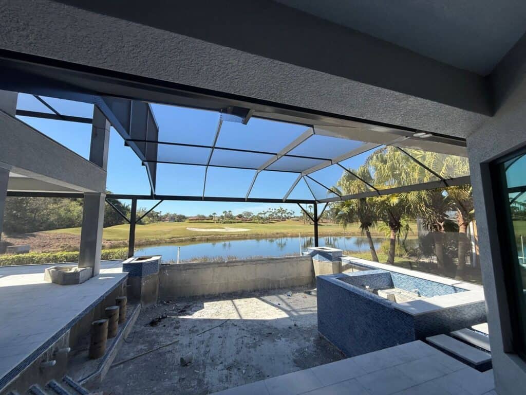 Interior view of a two story to single story pool cage enclosure in Fort Myers Florida