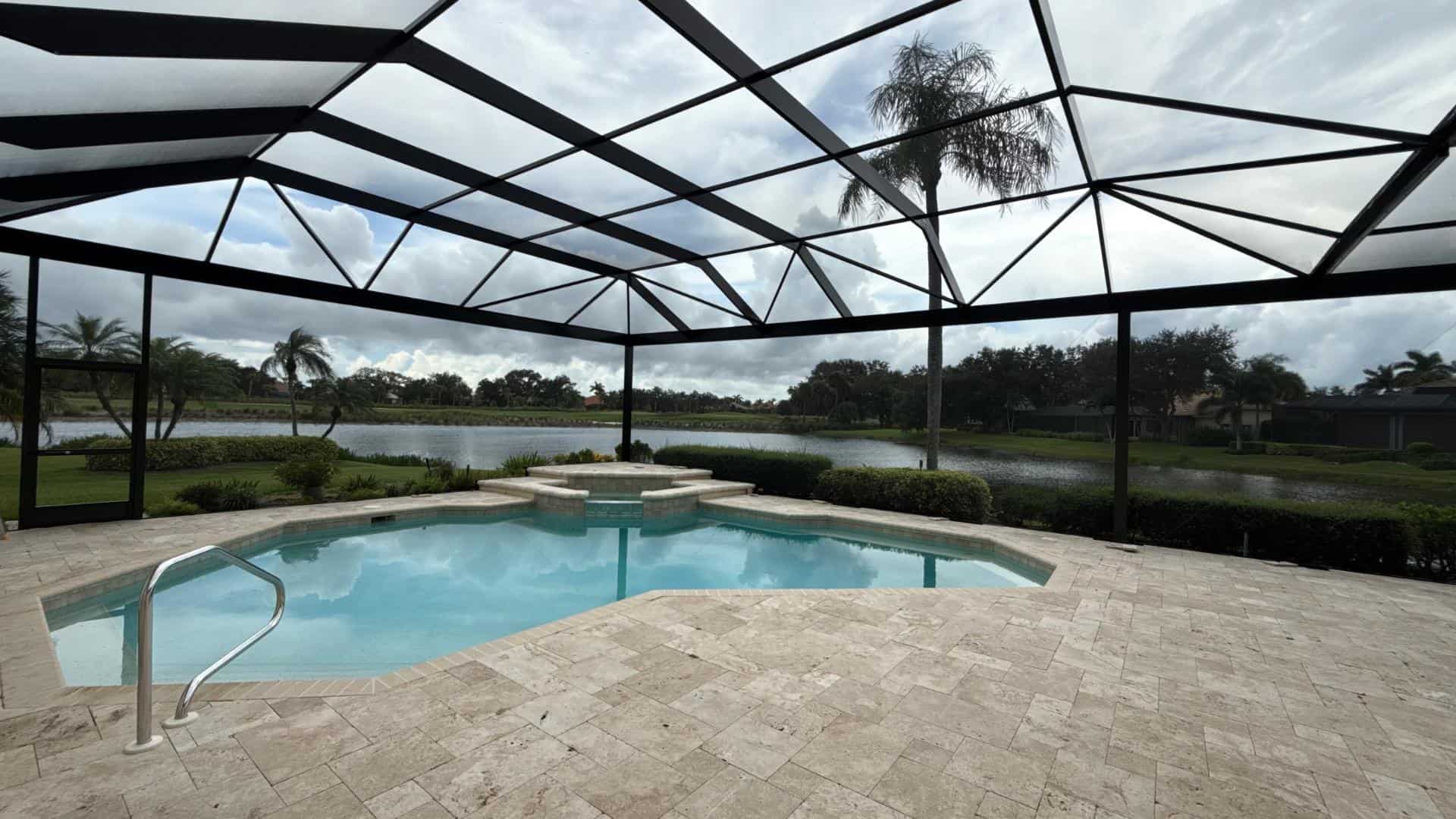Fort Myers picture window pool enclosure with panoramic backyard view