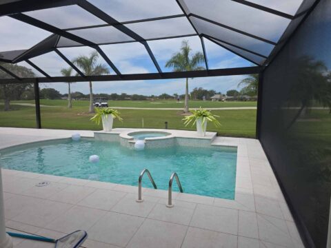 Custom aluminum pool screen enclosure overlooking golf course in Naples Florida