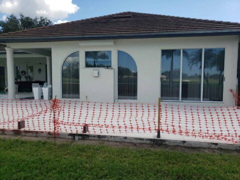 Backyard pool area before lanai screen enclosure installation Naples Florida