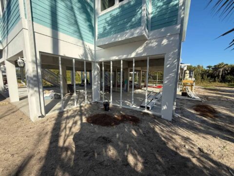 Aluminum framing for privacy panel system under stilt house Sanibel Island Florida