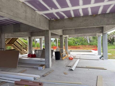 Elevated coastal home before upstairs screen enclosure and aluminum railing installation Sanibel Island Florida