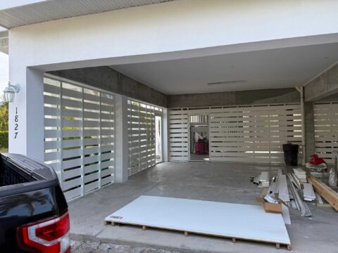 Aluminum privacy panel system under elevated coastal home Sanibel Island Florida