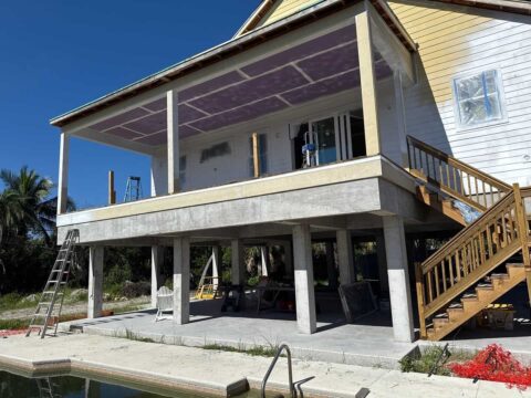 Underneath stilt home before installation of privacy panels and pool enclosure Sanibel Island Florida